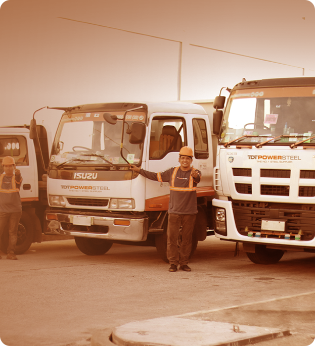 A collective of men positioned in front of a truck, representing a scene of friendship and shared purpose.